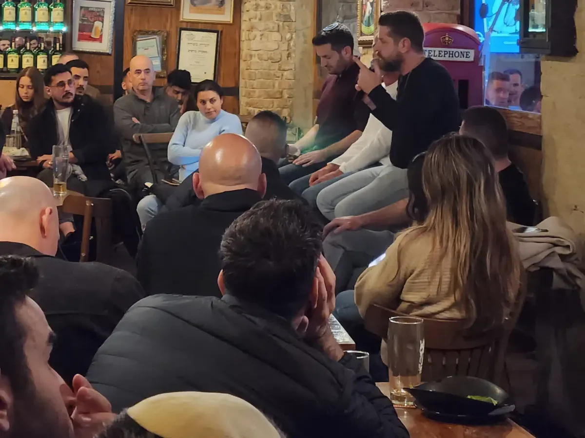A ClubRRRR community meetup: investors gathered around a speaker taking questions